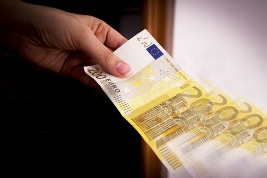 Intention to make a payment with a two hundred euro bill