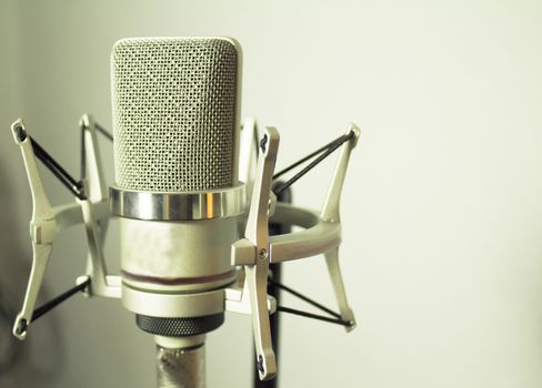 Professional microphone silver on white background