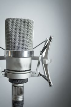 Professional microphone silver on white background