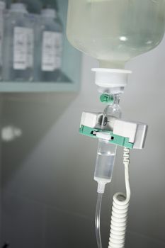 Plastic bottle of serum in surgical operation
