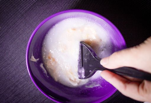 Woman removing hair dye mixture