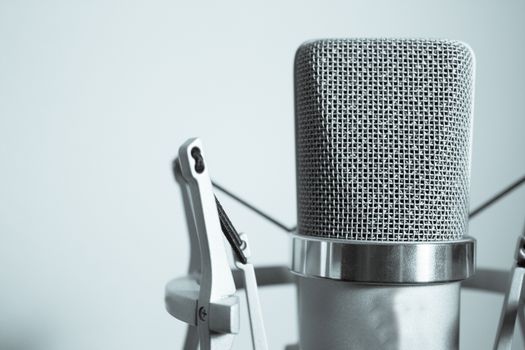 Professional microphone silver on white background