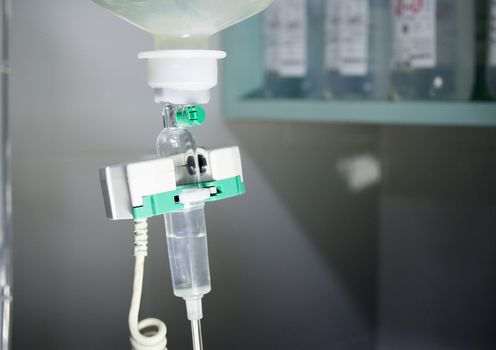 Plastic bottle of serum in surgical operation