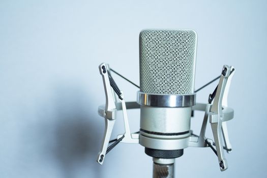 Professional microphone silver on white background