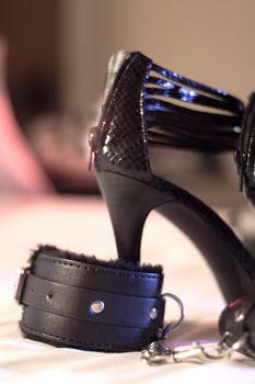 Handcuffs for erotic games. Submission. Bondage.