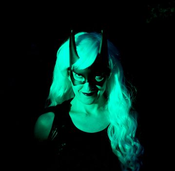 Woman in disguise with black mask and long white hair wig