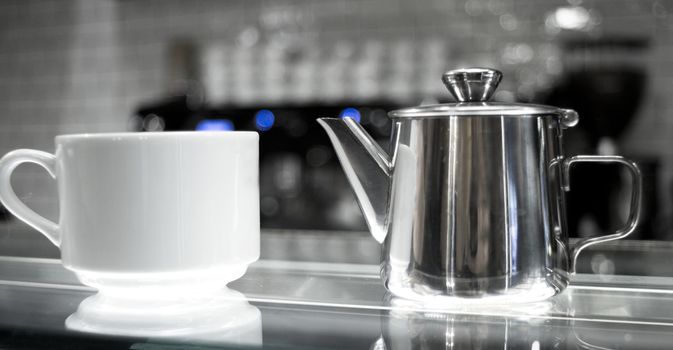 Whhite coffee cups on glass counter