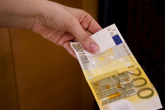 Intention to make a payment with a two hundred euro bill