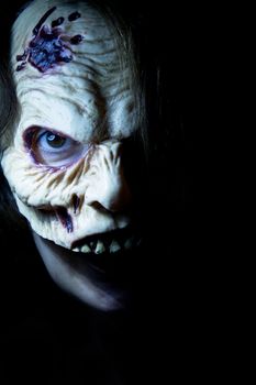Portrait of a zombie woman at halloween party