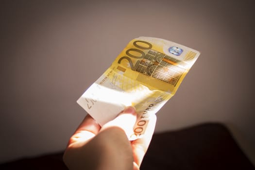 Intention to make a payment with a two hundred euro bill