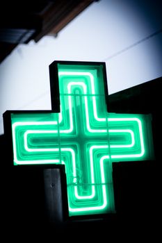 Luminous green cross. No people