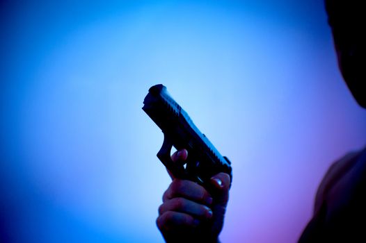 Gun held by a mans hand
