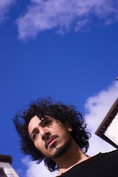 Portrait of man with beard on urban background