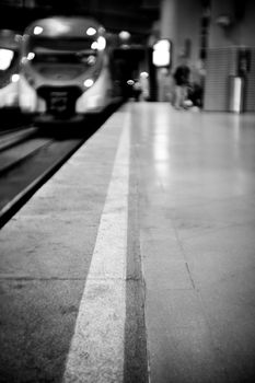 Empty train station with unfocused train, lonely environment