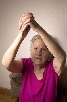 Rehabilitation exercises for an older woman with cerebral stroke