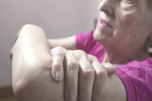 Rehabilitation exercises for an older woman with cerebral stroke