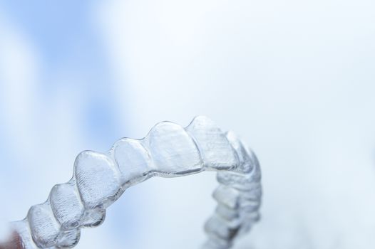 Invisible orthodontics to align the teeth