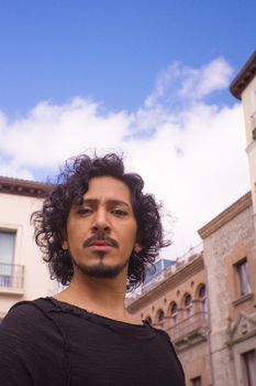 Portrait of man with beard on urban background