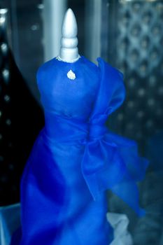 Blue fabric simulating dress for wedding guest