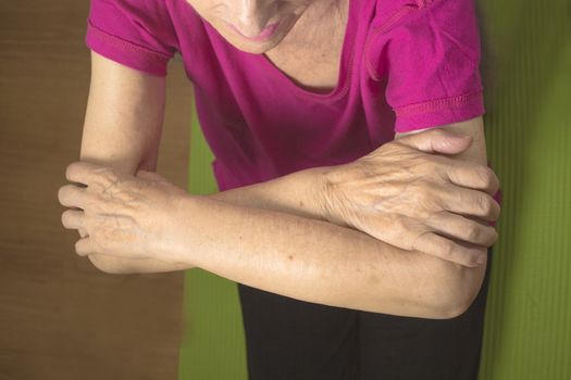 Rehabilitation exercises for an older woman with cerebral stroke