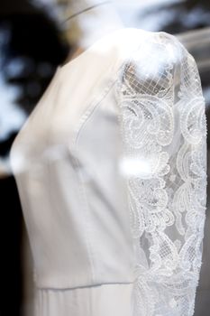 Part of a generic wedding dress. No people