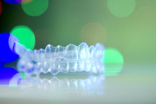 Invisible orthodontics on bokeh background. No people