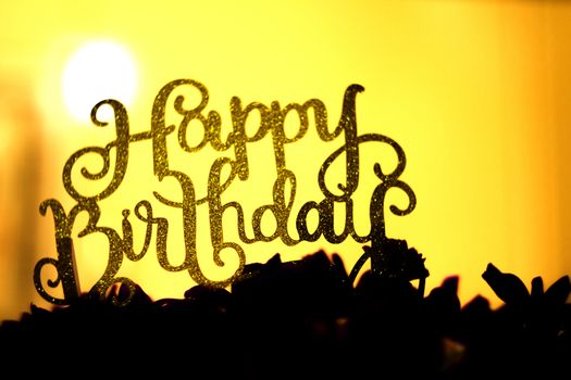 Flower arrangement with happy birthday sign