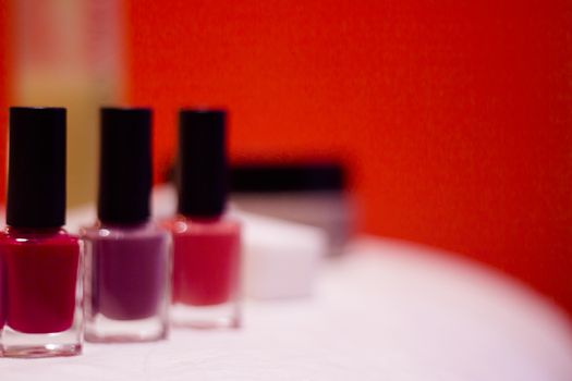 Nail polishes with strong colors. No people. Copy space