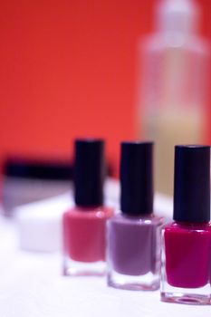 Nail polishes with strong colors. No people. Copy space