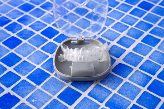 Transparent dental orthodontics in a protective box. No people