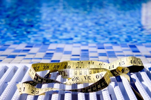 Measuring tape on pool background. No people