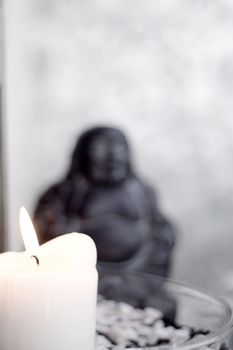 Generic buddha decoration with candle and flower. Relax scene
