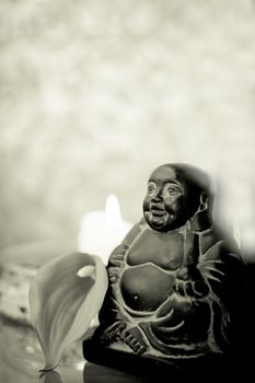 Generic buddha decoration with candle and flower. Relax scene