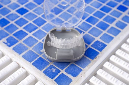 Transparent dental orthodontics in a protective box. No people