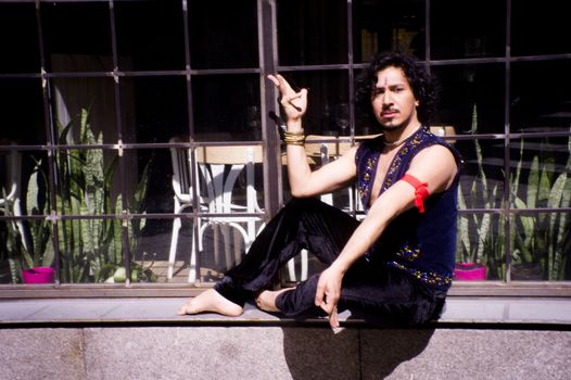 Bollywood dancer man over urban background