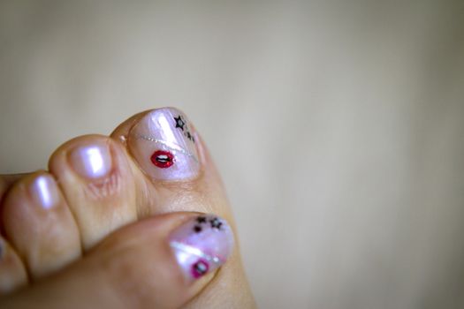 Hand and foot of woman with manicure. Beauty care