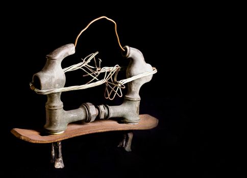 Modern sculpture made with recycled materials.  Similar to human emotions and gestures.