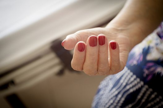 Hands of old woman and elderly caregiver