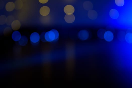 Blue and golden background with bokeh effect. Copy space