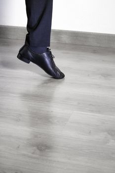 Feet dancer dancing salsa. Copy space