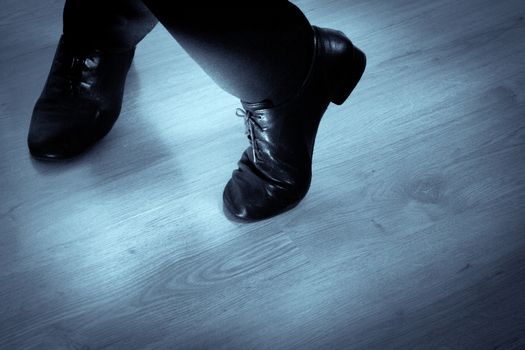 Feet dancer dancing salsa. Copy space