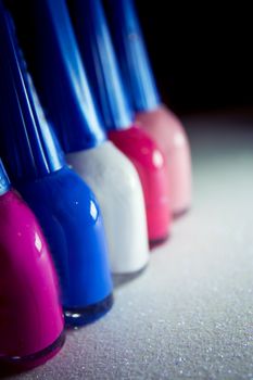Nail polish placed in line. Copy space