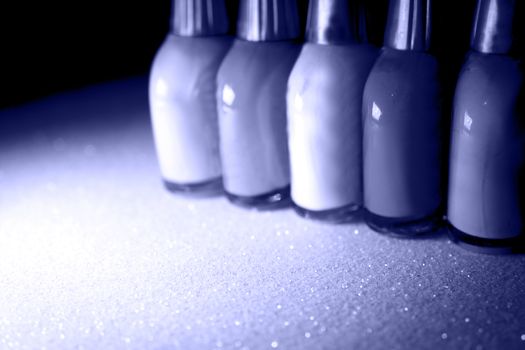 Nail polish placed in line. Copy space