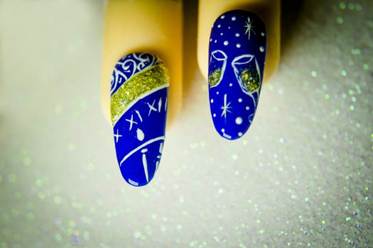 Permanent gel nails with new year decoration.  Bright background