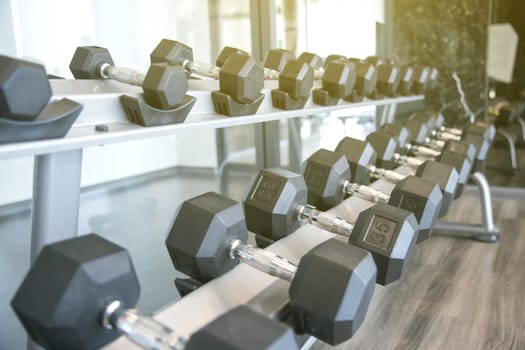 Sports dumbbells in modern sports club for a exercise in the fitness center in gym,Weight Training Equipment