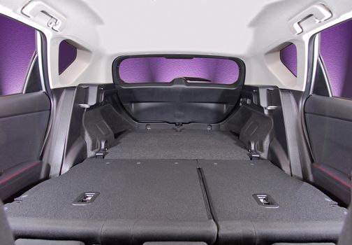 car trunk with rear seats folded, inside view