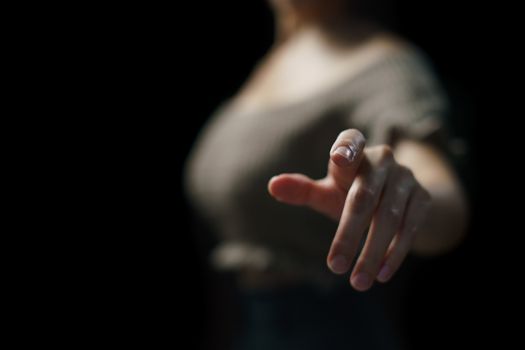 Woman touching Visual screen with her finger.