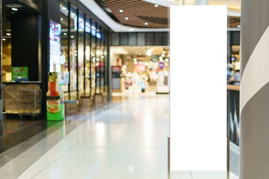 White blank billboard or advertising light box for text message in department store shopping mall, shopping center. marketing concept