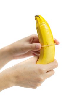 Condom on banana on white background, Safe sex concept. isolated