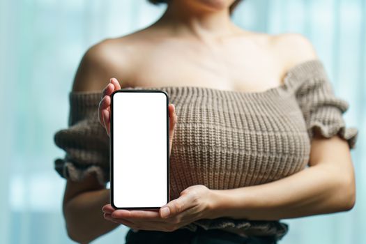 Sexy woman showing white blank display of her mobile phone.